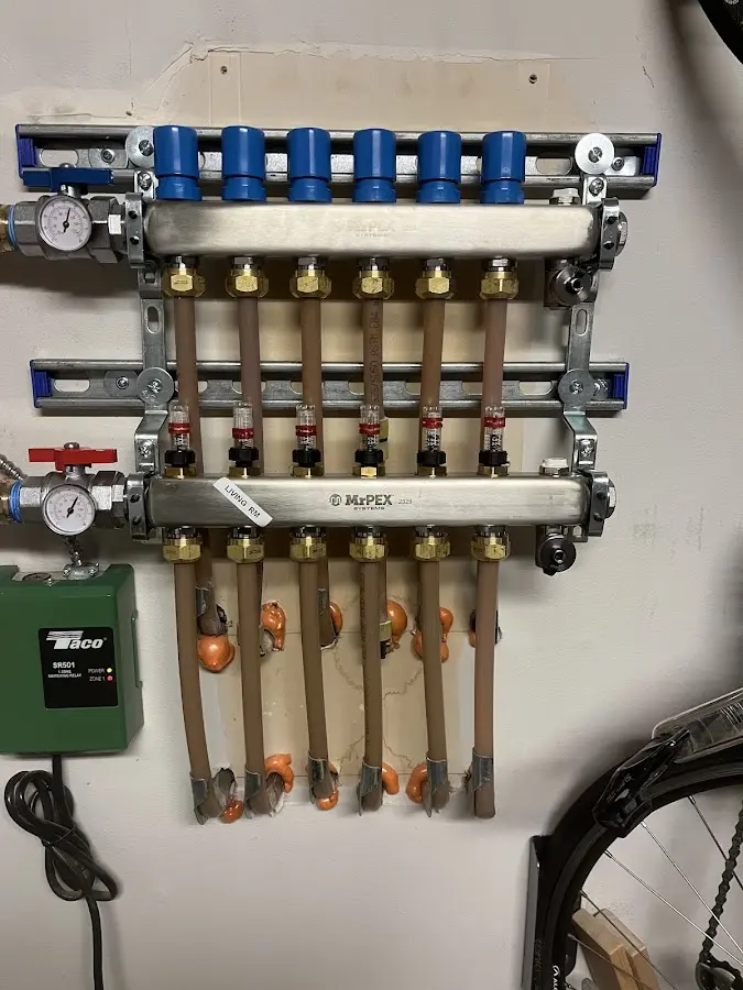 Plumber performing Water Heater Repair at a residential property in Rock Valley